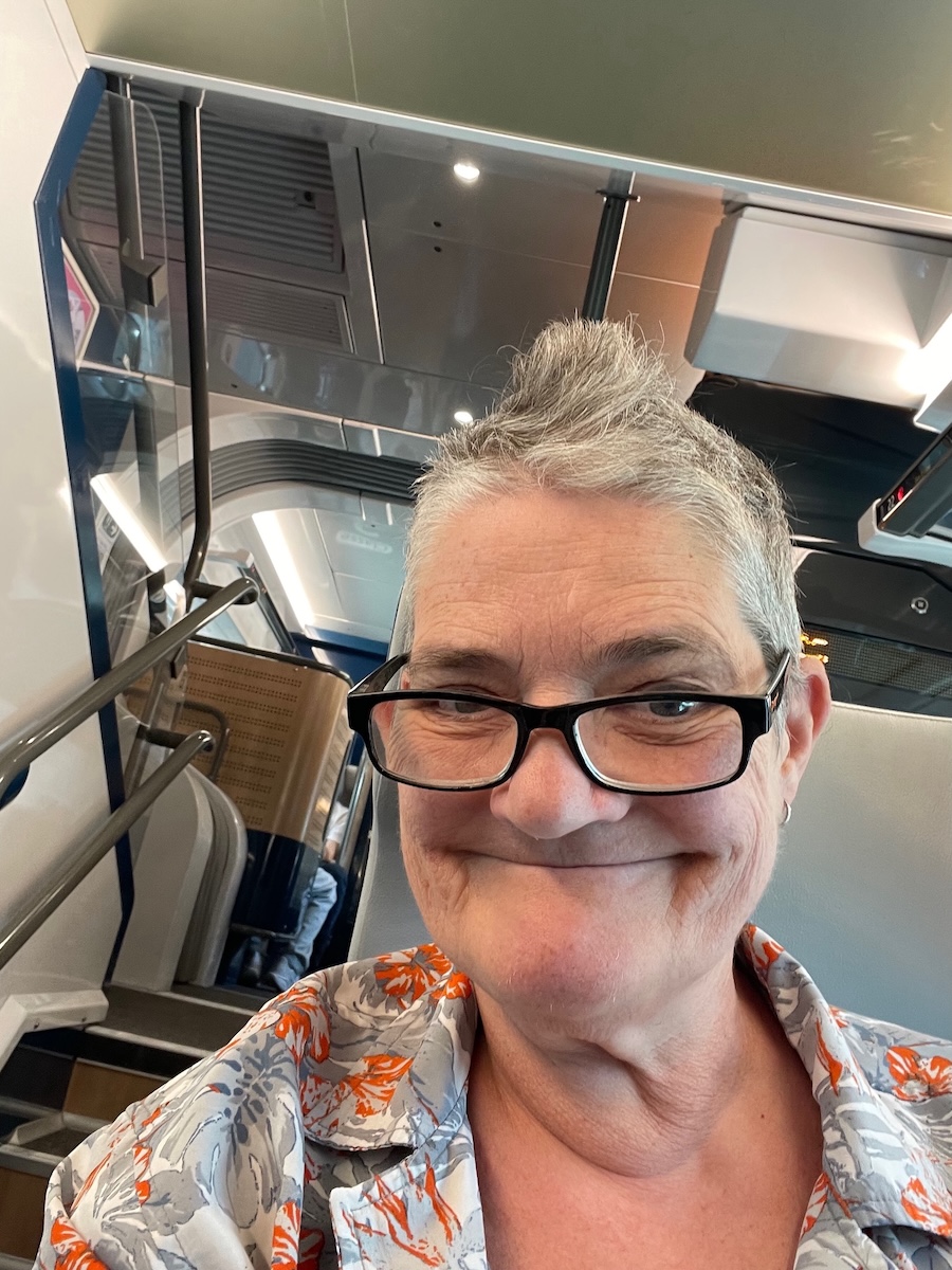 Al Double Decker Train France Al sitting on a double decker train in France smiling