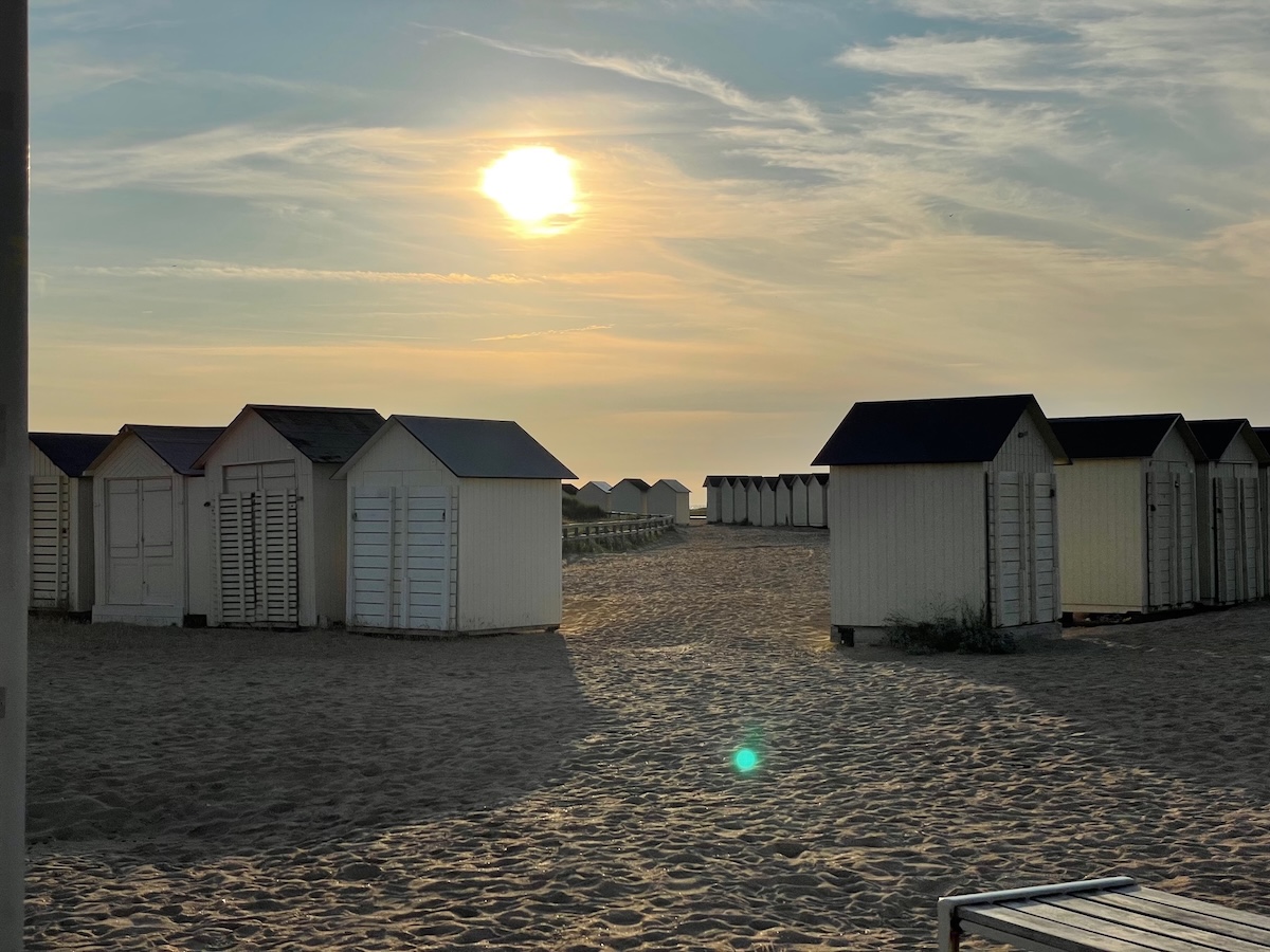 Beach at Ouistreham Beach huts at Ouistreham