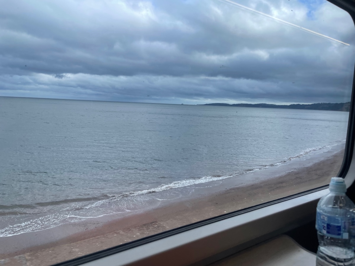 Train tracks by the sea train tracks and view of the sea from the train in Cornwall