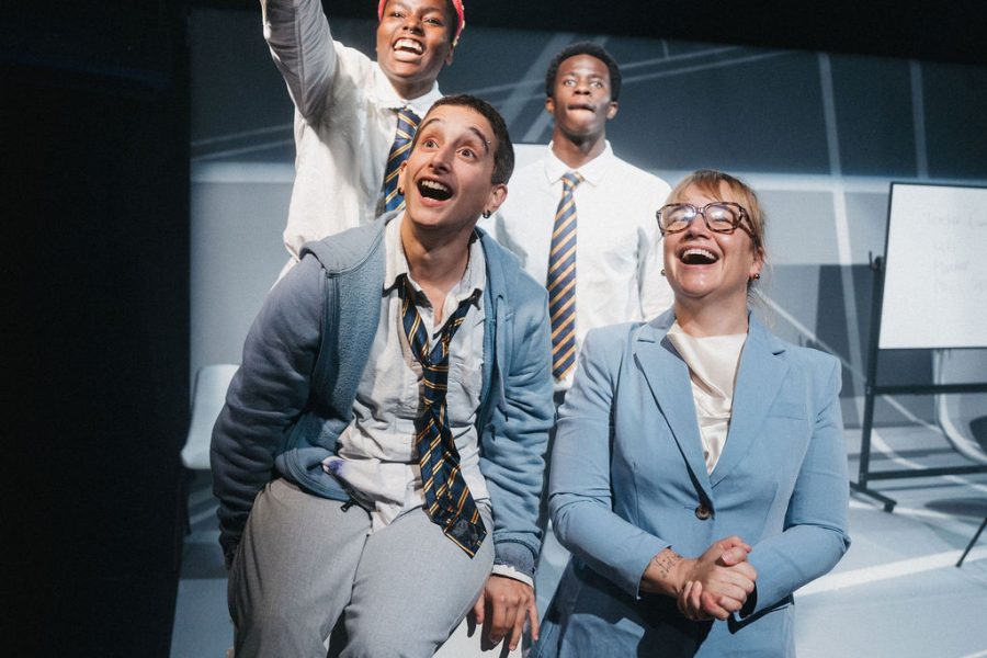 4 performers looking up, one is pointing to where they are looking and they all look happy, on the set of A Class of Your Own